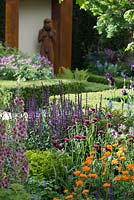 The Morgan Stanley Healthy Cities Garden, view of flowerbed with Geum 'Prinses Juliana', Cirsium rivulare 'Atropurpureum', Salvia nemorosa 'Caradonna' and Euphorbia 