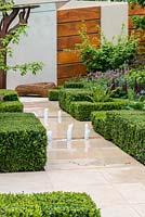 Morgan Stanley Healthy Cities Garden. A formal structure of box hedges and stone paths contrast with a tapestry of perennials.