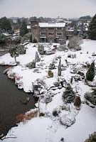 View of Kilver Court garden in Somerset from the viaduct, covered in snow