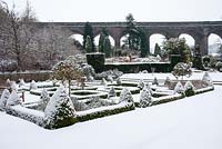 The parterre at Kilver Court in Somerset, covered in snow, viaduct in background