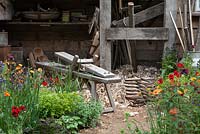 The Trugmaker's Garden, detail of workbench and planting.  RHS Chelsea Flower Show, 2015