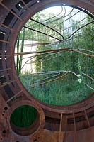 The Dark Matter Garden for the National Schools' Observatory - a hard core design with upcycled steel is planted with bamboo, Verbascum, and Ligularia. RHS Chelsea Flower Show, 2015