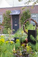 Rusted tin can sculpture - The Great Chelsea Garden Challenge