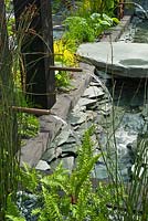 Slate water feature in The RHS Great Chelsea Challenge Garden.  RHS Chelsea Flower Show 2015
