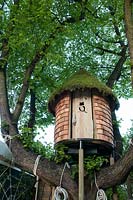 Treehouse built in mature tree. RHS Chelsea Flower Show 2015