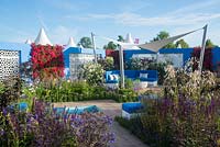 Sheltered Mediterranean garden with living wall, curved seating and canvas sail - Noble Caledonia: Spirit of the Aegean, RHS Hampton Court Palace Flower Show 2015