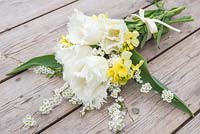 Floral bouquet made with Tulipa 'Swan Wings', Cheiranthus cheiri 'Ivory White' and white spring blossom