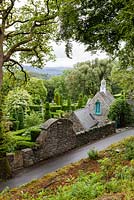 View over the garden from the wood. Plas Brondanw Garden, Wales. Designed by and was the home of Sir Clough Williams-Ellis. July 2015