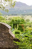 View over the garden from the wood. Plas Brondanw Garden, Wales. Designed by and was the home of Sir Clough Williams-Ellis. July 2015