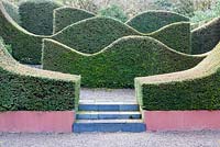 The Hedge Garden. Wave form hedges of Taxus baccata. Veddw House Garden, Monmouthshire, South Wales. March 2015. Garden designed and created by Charles Hawes and Anne Wareham