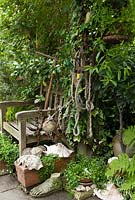 Wooden chair draped in rope, chains and an anchor and surrounded by shells. Plants included Lobelia, ferns and ivies.