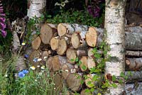 Log stack in nature garden