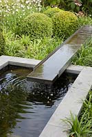 Rill water feature leading to a pond