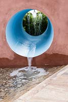 Blue water tunnel channelling water into a pool.  Designer: Stefano Passercotti, Sponsored by Sabo Oil