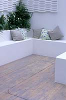 Decking with inset lighting and seat built into wall