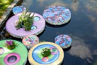 Idiosyncratic floating garden features in the ponds of Regents Park, London
