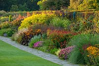 The famous double mixed herbaceous border in september stretching 128 metres down the hill. RHS Garden, Wisley, Surrey 