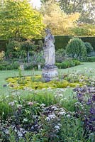 Statue in formal garden in early summer - Helmingham Hall, Suffolk
