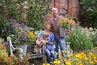 Patrick Cadman and Sheree King with their dogs in the cutting garden