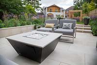 Liquid propane fire pit within the sunken seating area