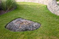 Lawn with sunken stone landscape feature. Follers Manor, Sussex. Designed by: Ian Kitson