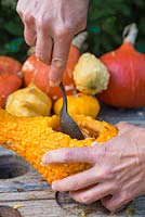 Use a spoon to scrape and hollow out the centre of the Gourd