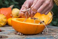 Form a secondary stopper for the Pumpkin roof by forming a Clove Hitch knot around a small twig