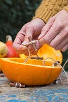 Form a secondary stopper for the Pumpkin roof by forming a Clove Hitch knot around a small twig