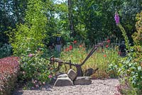 Old plough in country garden 
