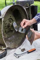Carefully remove the mower blade sections and keep them together, so you know which way to correctly reattach them