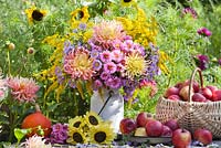 Floral and harvest display of Asters, Dahlias, Sunflowers and Apples.