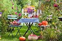 Floral and harvest display of Asters, Dahlias, Sunflowers and Apples. Harvest Time. 
