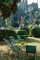 View into The Lemon Garden. Citrus in terracotta pots. Hedges of box. Villa Capponi, Florence, Tuscany, Italy. September. 