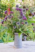 A rustic autumnal bouquet made with Verbena bonariensis, Echinops ritro, Echinacea Large Flowered, spent Japanese anemone and seed heads of Dill, Comfrey and Crocosmia.