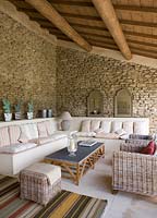 Pool house with rattan furniture and sofas 
