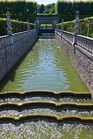 A moat of water bordering the gardens at Chateau de Villandry, Loire Valley, France