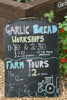 Signage. Garlic bread workshops and farm tours. The Garlic Farm. Isle of Wight. 