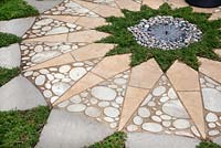 Pebble mosaic star in the 'Bring Me Sunshine' Garden, at RHS Tatton Flower Show 2015