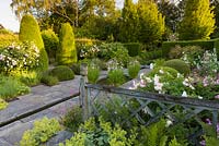 The Lower Rill Garden at Wollerton Old Hall Garden, Shropshire, planting includes Rosa Wollerton Old Hall, Iris ensata, Hydrangeas and Alchemilla mollis
