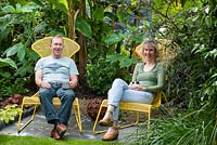 Brian and Julie Linden sitting in their garden