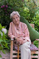 Beth Chatto, 91, sittiing on her terrace in the shade of a Magnolia soulangeana which she planted as a tiny sapling, some 60 years previously.