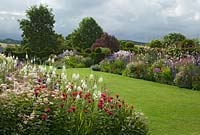 Colourful flower borders at Felley Priory, Underwood, Nottingham in July.