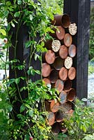 Bug house made from recycled materials in The Great Chelsea Garden Challenge Garden