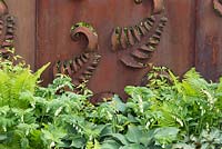 Rusted steel fern wall panel fence, planting of Ferns, Hosta, Constraining Nature garden - designed by Kate Durr Garden Design - Best Festival Garden award and a gold medal - RHS Malvern spring festival 2015