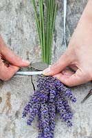 Making a lavender wand step by step. Use a butter knife to gently compress the stems just below the ribbon. This makes the stems more pliable so they can be bent without breaking.