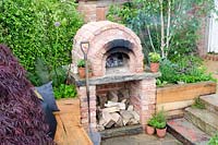 Sunken seating area with outdoor oven - 'A Fruity Story' - RHS Malvern Spring Festival 2014