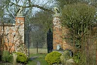 Iron gate into the walled kitchen garden.