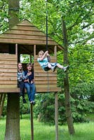 In the treehouse, Victoria and Freddie push off Ludo on the zip wire.