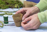 Use the florist wire to secure the Peat free fibre pots to the wreath frame
