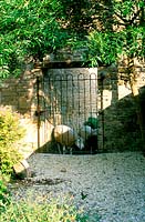 Jonathan Dimbleby's garden, near Bath. Sheep viewed through gate
